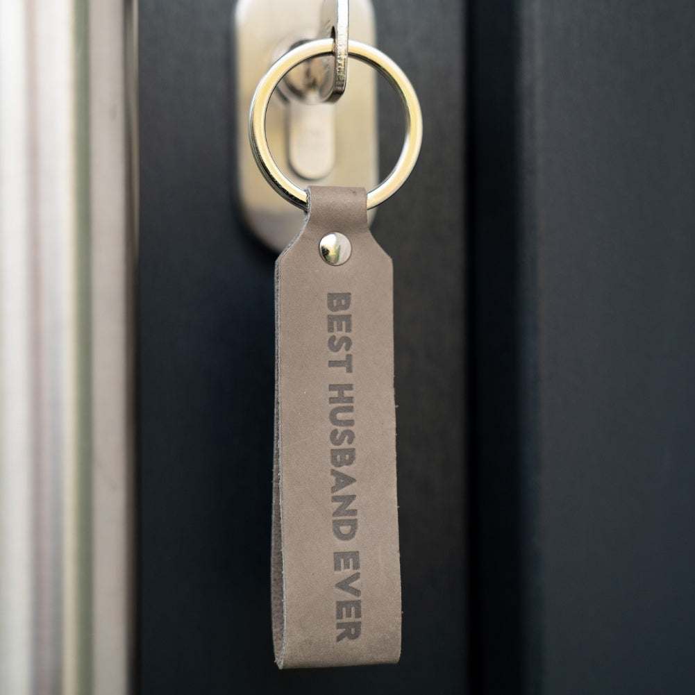 Leather keychain with "Best Husband Ever" engraving, gray color, durable craftsmanship from Germany.
