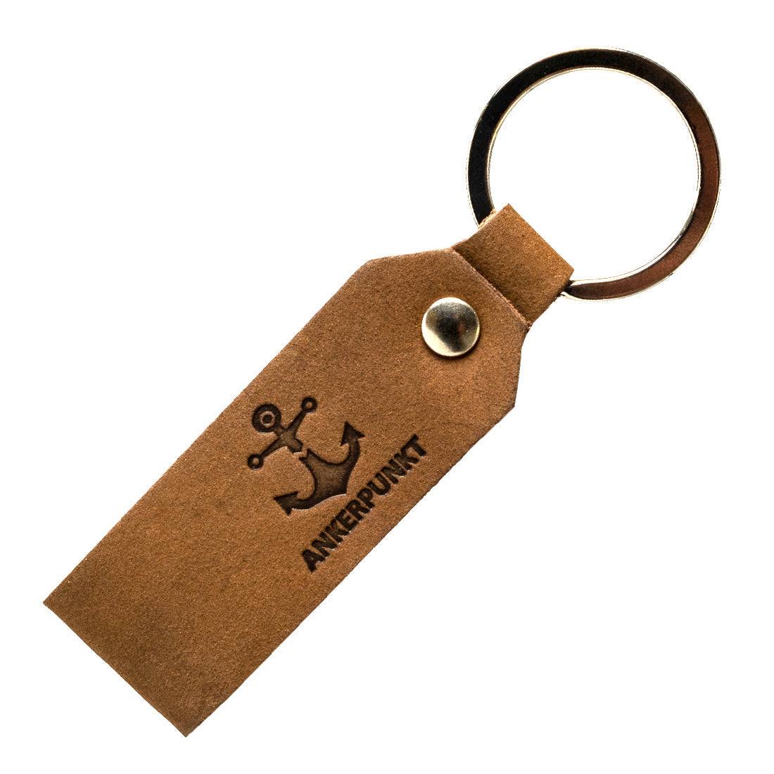 Dark brown leather heart keychain made in Germany, durable and eco-friendly.