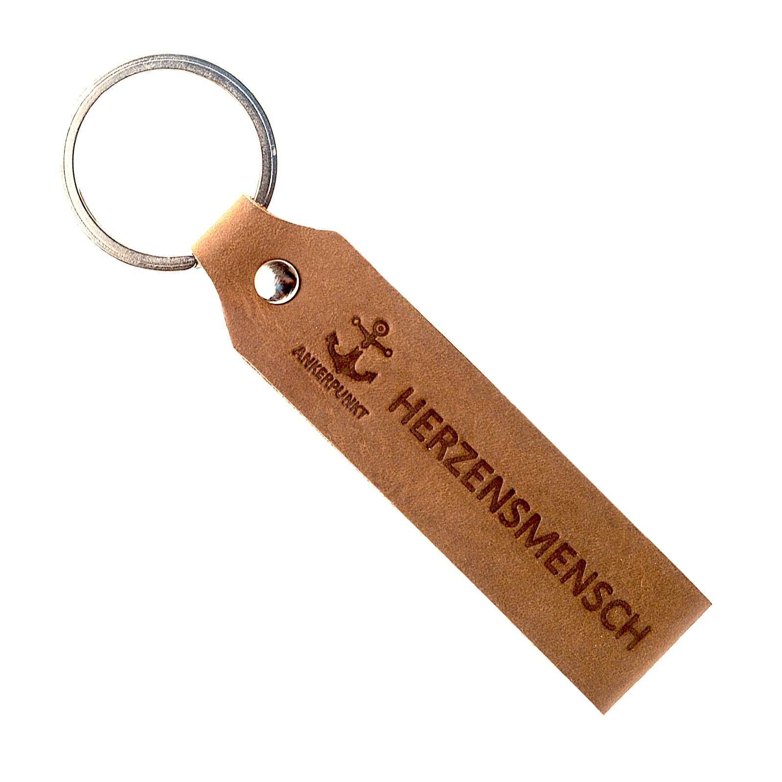 Dark brown leather keychain with "HERZENSMENSCH" engraving, made in Germany. Perfect gift for loved ones.